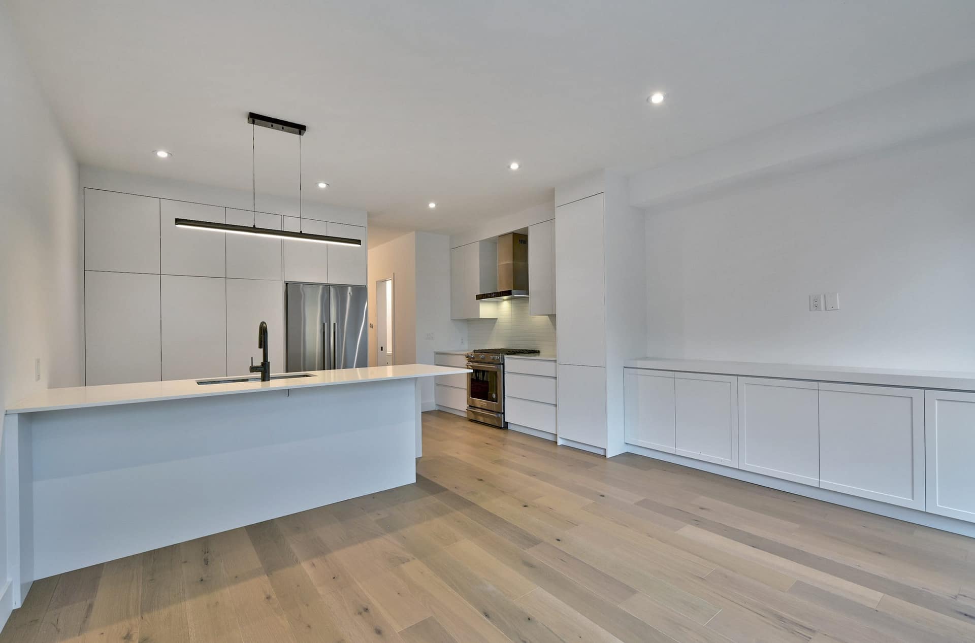 Before: Vacant open-concept kitchen before virtual staging for a GTA listing