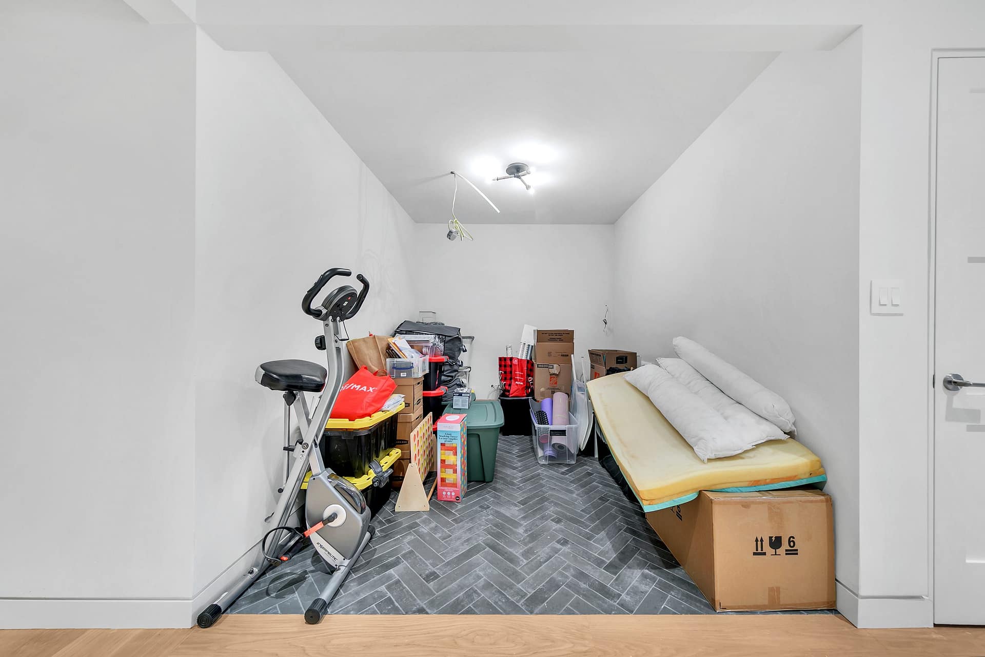 Before: Cluttered storage alcove before listing photo decluttering