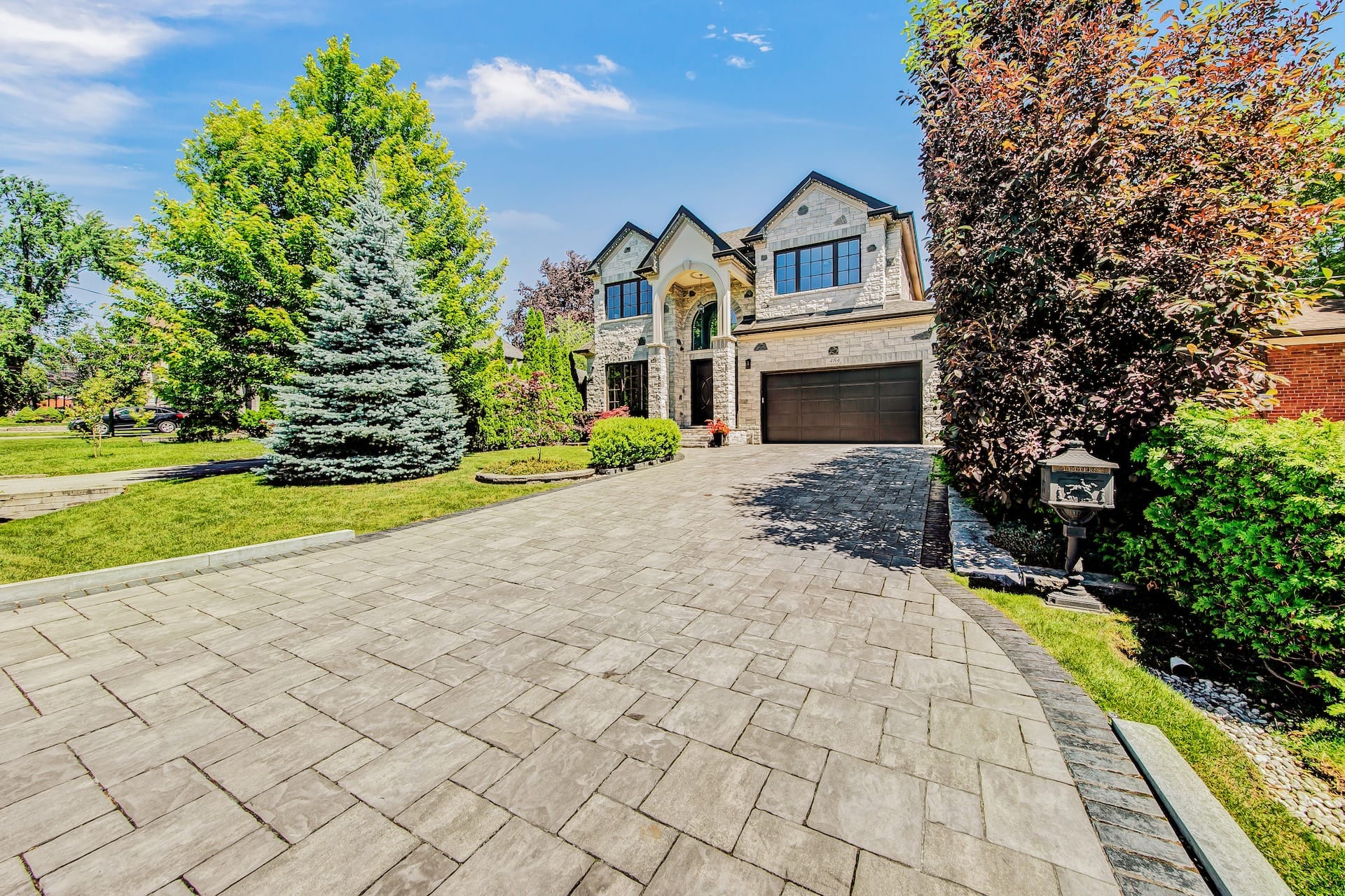 Before: Daytime exterior of a detached Mississauga home before twilight conversion