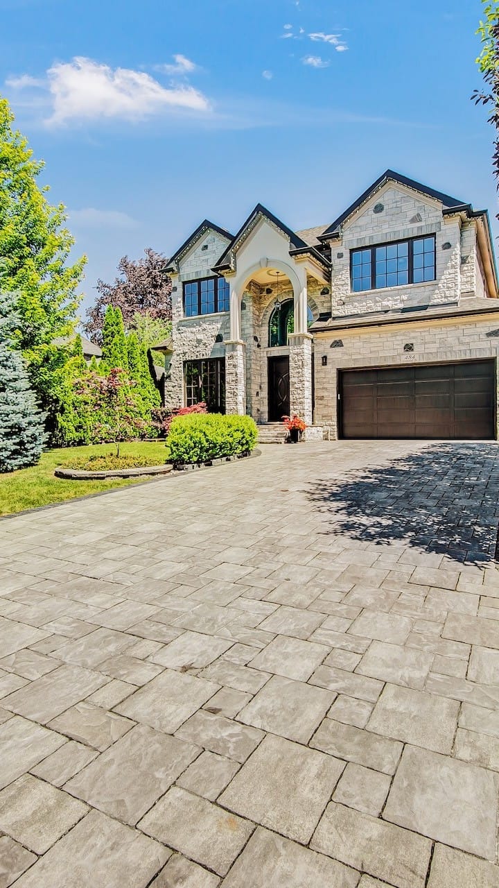 Don't for MLS: vertical exterior crop that wastes space on driveway and clips house width